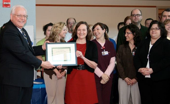 Howard Eikenberry and staff of Boone County Hospital receiving CAH Recognition certificate