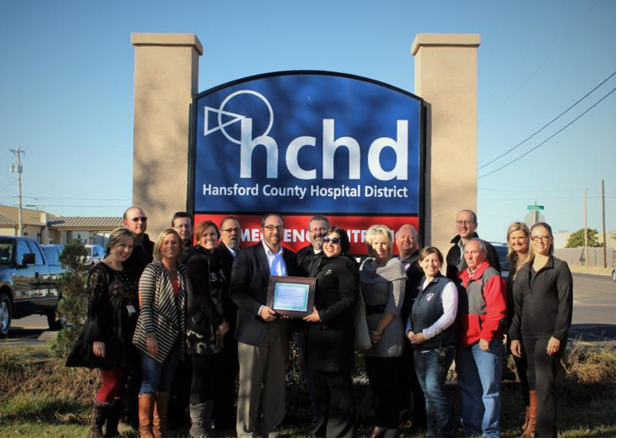HCHD CEO and staff receive CAH Recognition certificate from Texas Flex Program officer