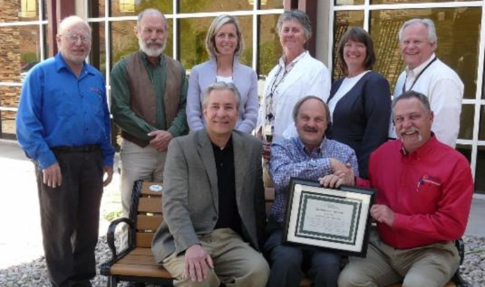 Utah Flex Program staff Greg Rosenvall and Don Wood present the certificate to MRH CEO, Robb Austin, Mike Bynum, Jaylyn Hawks, Bob Jones, Dr. Kathy Williams, Craig Daniels, Vicki Gigliotti