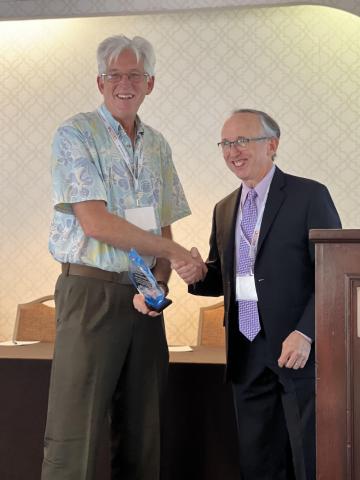 Scott Daniels accepting 2023 Calico Award