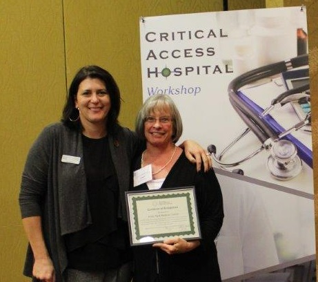 Estes Park Medical Center Quality Director Janet Zeshin receives CAH Recognition certificate from Michelle Mills, Colorado Rural Health Center