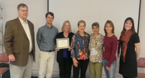 Dan Boatman, CEO, and staff of Granite County Medical Center receive CAH Recognition certificate, presented by Natalie Claiborne, Montana Office of Rural Health
