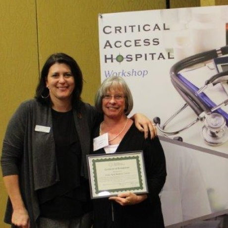 Estes Park Medical Center Quality Director Janet Zeshin receives CAH Recognition certificate from Michelle Mills, Colorado Rural Health Center