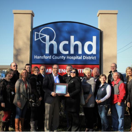 HCHD CEO and staff receive CAH Recognition certificate from Texas Flex Program officer